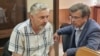 Евгений Мищенко (на фото слева) и его адвокат Николай Фомин в зале суда